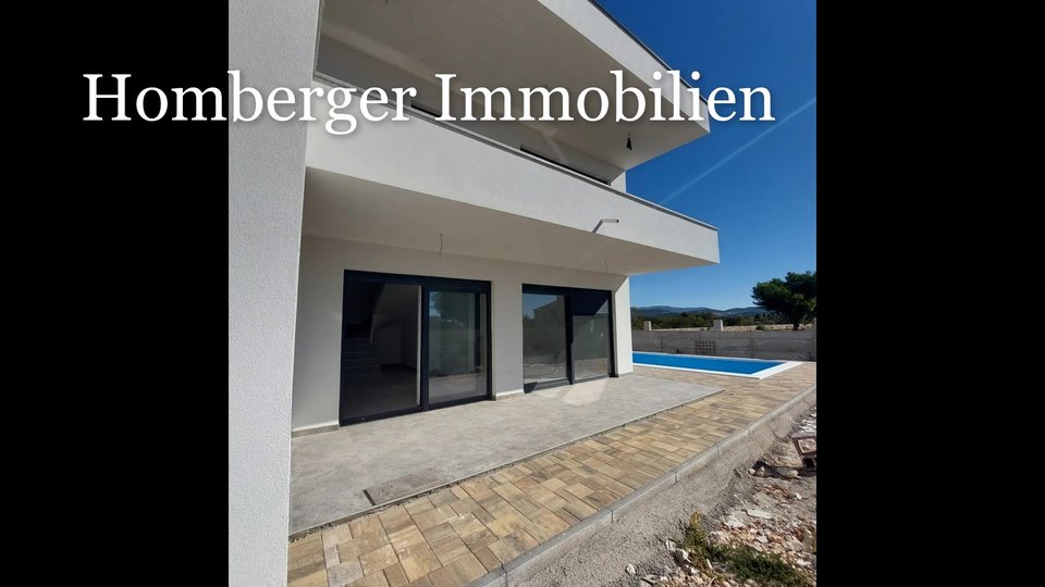 A modern semi-detached house near Šibenik with a swimming pool is waiting for you